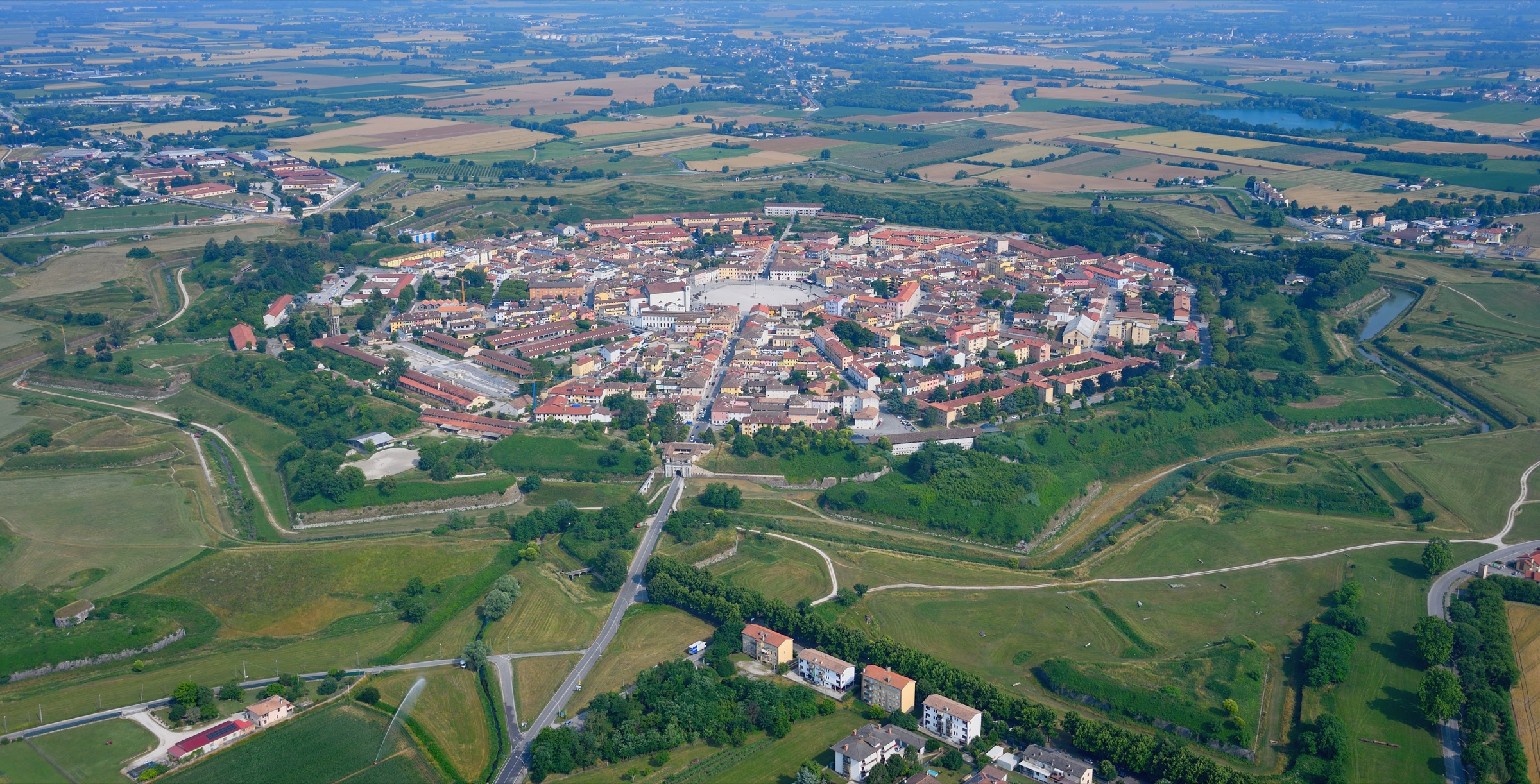 The nine-pointed star fortress of Palmanova seen from the air, ringed by walls, moats and outer works